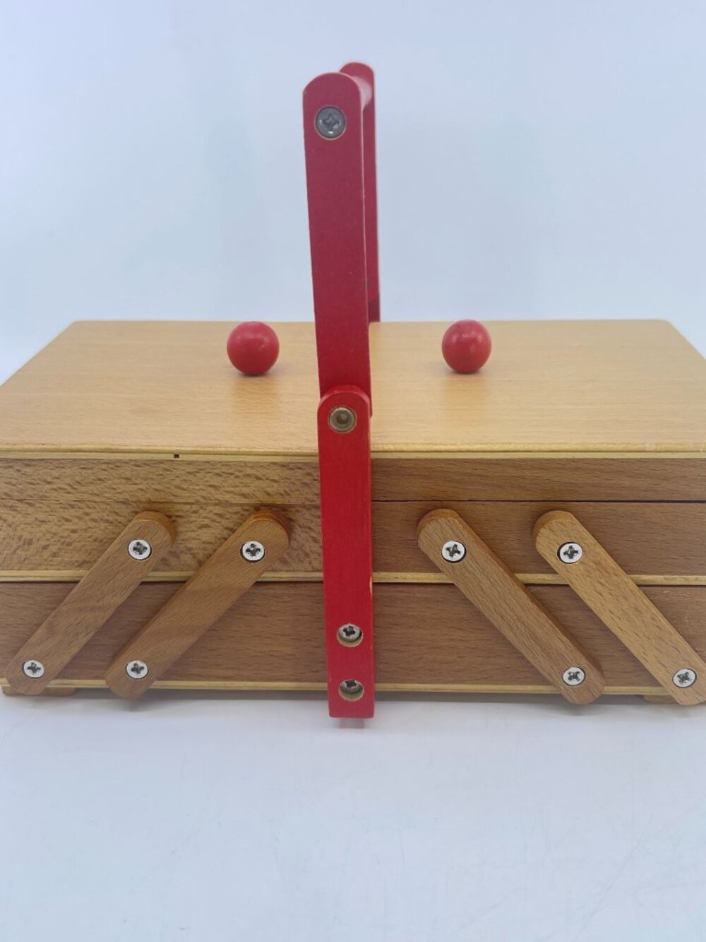 vintage wooden accordion sewing box with red articulated handle & knobs